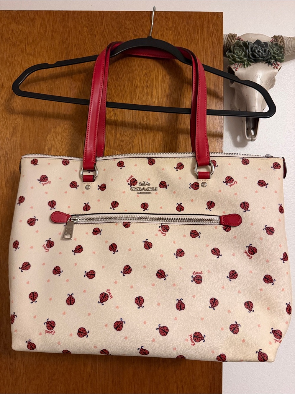 Coach tote bag ladybug logo design